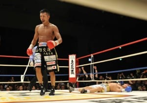 Takashi Uchiyama of Japan (L) sinks Jorge Solis of Mexico (R) on the ring in the 11th round of the WBA super featherweight unification title match in Yokohama, suburban Tokyo on December 31, 2011. Title-holder Takashi Uchiyama of Japan scored a technical knockout to beat interim champion Jorge Solis of Mexico to defend the World Boxing Association (WBA) super featherweight.         AFP PHOTO / KAZUHIRO NOGI (Photo credit should read KAZUHIRO NOGI/AFP/Getty Images)